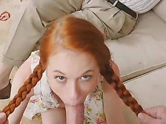 Redhead slut with pigtails sucks an older man's hard dick